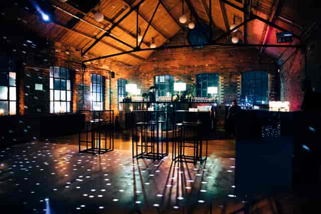 Stylish Loft Studios event space with exposed brick walls, ideal for networking and gatherings.