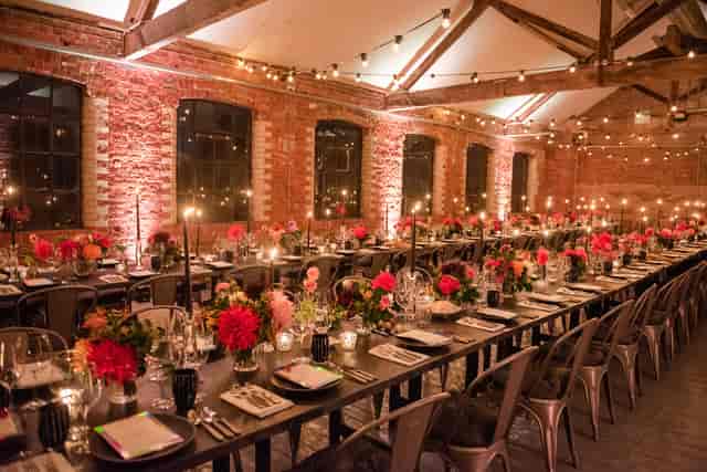 Elegant event space with floral centerpieces and candlelight at Loft Studios.