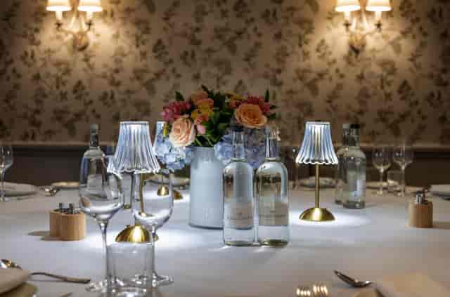 Private dining in The Eaton suite with elegant accent lamps for luxury events and celebrations.