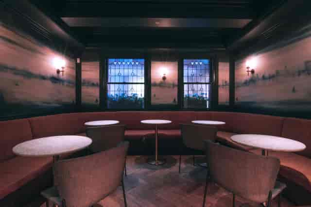 Stylish meeting space 'Le Première' with plush seating, ideal for networking events.