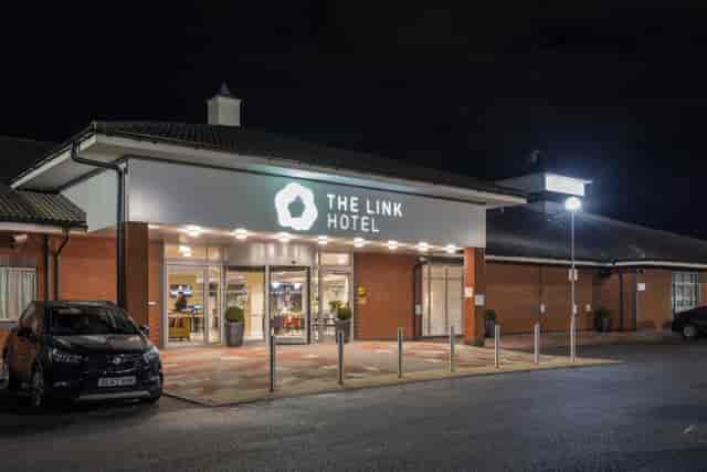 Modern hotel entrance at The Link Hotel, perfect for meetings and events.
