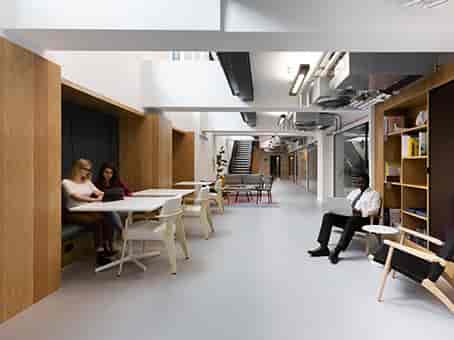 Modern meeting room with cozy seating for workshops and networking events.