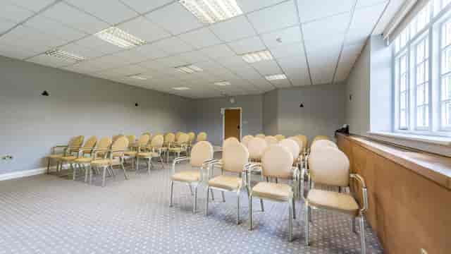 Versatile meeting room at The Carriage, Elvetham, ideal for corporate events and workshops.