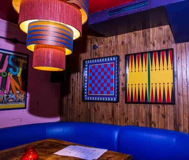 Vibrant event space at Flatmates Den with colorful decor for casual gatherings and team-building.