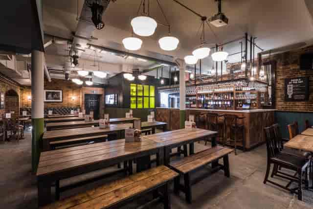 Spacious Beer Hall in Draft House Farringdon, ideal for networking and casual gatherings.
