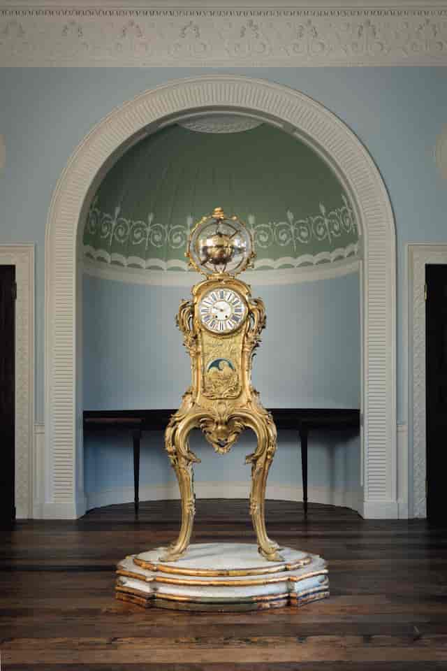 Ornate grandfather clock in Georgian Eating Room, perfect for upscale events and galas.