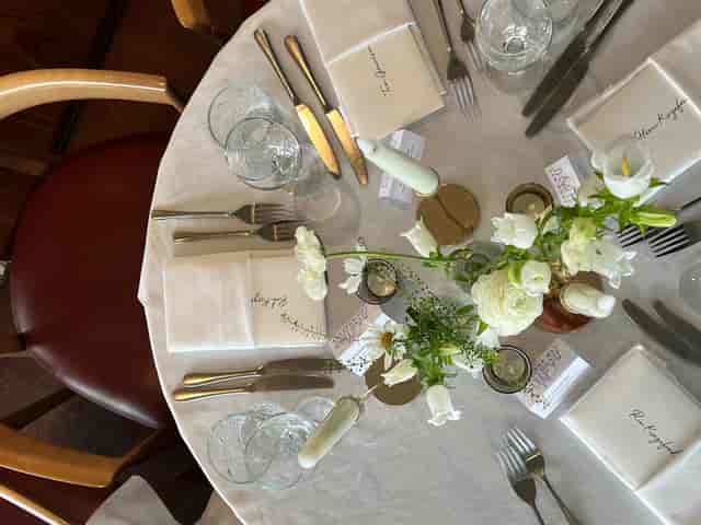 Elegant dining table with floral centerpieces at The View @LSQ for special events.