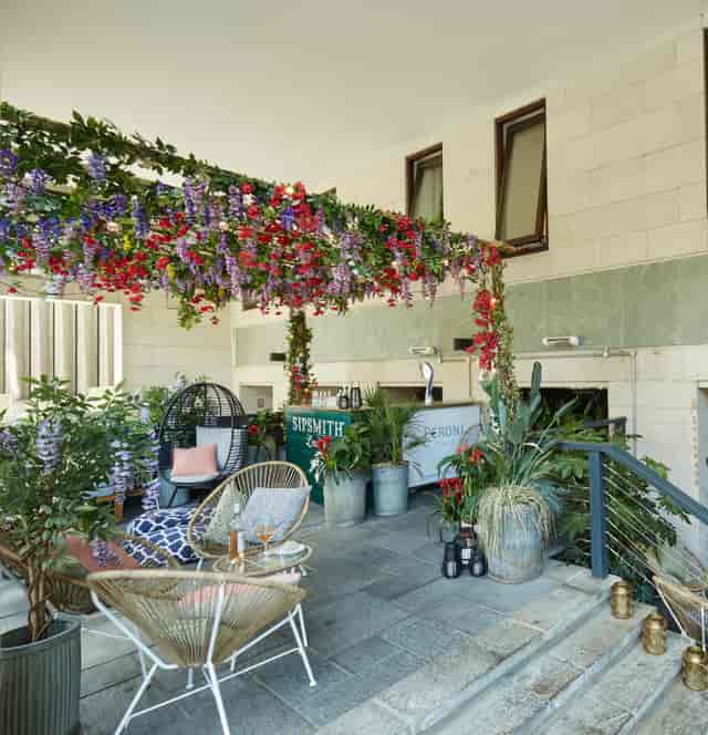 "Summer Terrace at Brasserie Blanc Southbank, lush greenery for networking events."