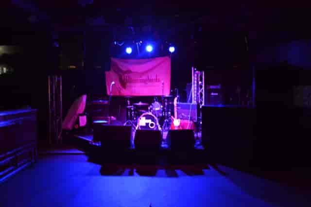 Live event stage at The Zanzibar Club with drum set, perfect for concerts and corporate functions.