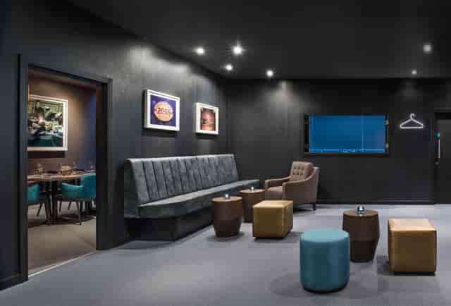 Modern underground meeting space with cozy seating for intimate gatherings.