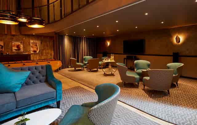 Stylish meeting space at THE DEN, ideal for networking events and intimate gatherings.