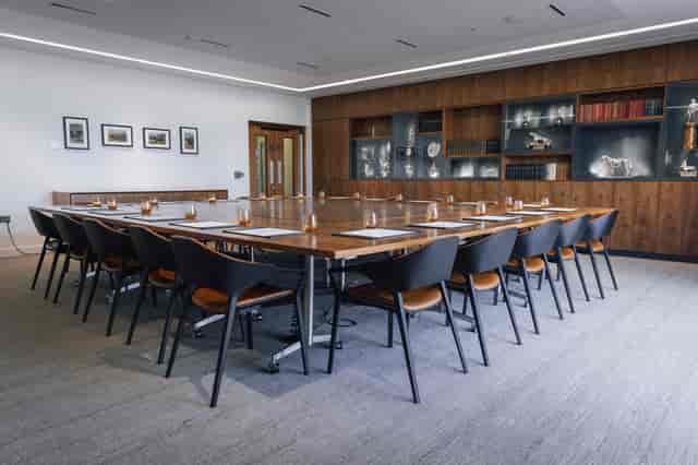 Modern conference room with wooden table for meetings at National Army Museum.