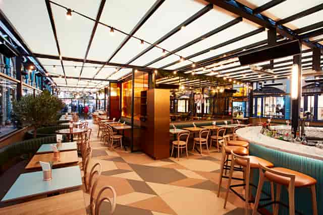 Stylish event space at Buns&Buns with natural light, perfect for networking and social functions.