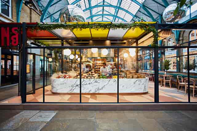 Vibrant Main Restaurant at Buns&Buns with marble counter, ideal for events and gatherings.