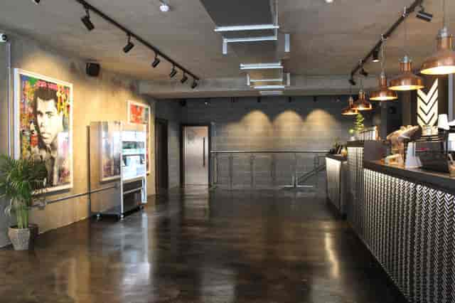 Modern event space with artistic decor, ideal for networking and gatherings.