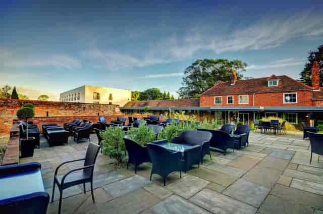 Cottage Boardroom at Lifehouse Spa: stylish outdoor event space with inviting seating.