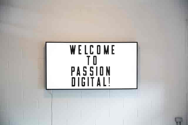 "Whole Mezzanine digital display welcoming attendees to a professional event."