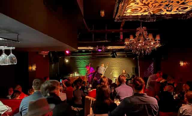 Vibrant event space at Piano Smithfield with engaged audience for performances and networking.