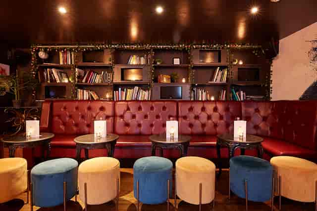 Stylish lounge at The Jujub, featuring plush red seating for networking events.