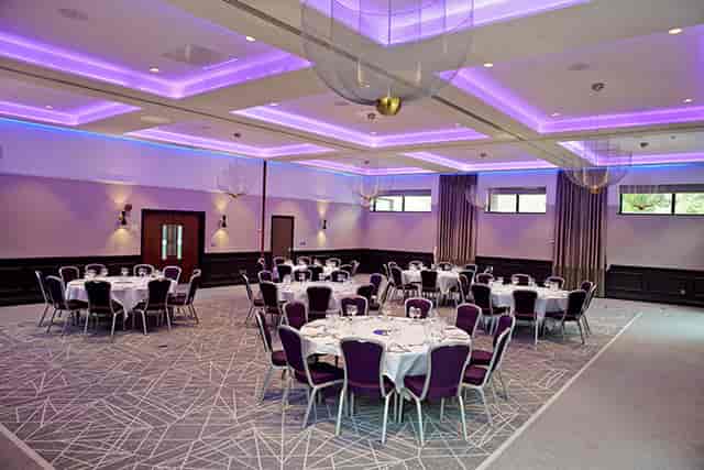 Elegant Princess Suite at Denham Grove for meetings and social gatherings, featuring round tables.