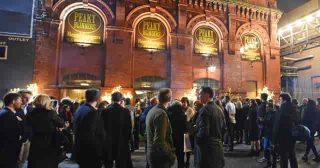 Peaky Blinders Bar Liverpool outdoor event with vibrant crowd and warm lighting.