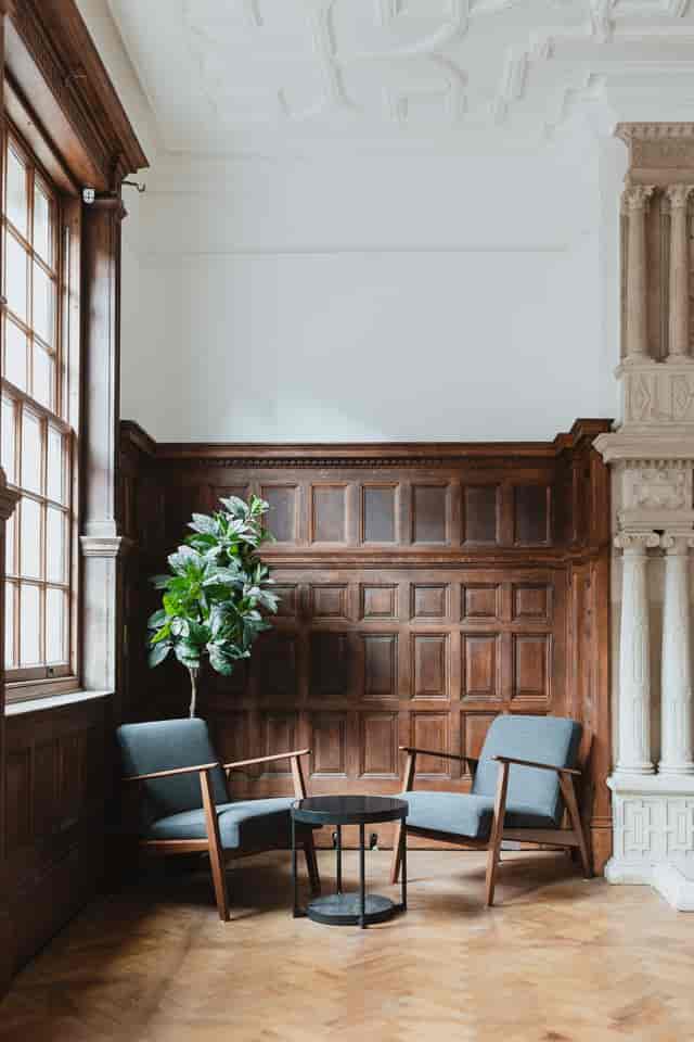 Sophisticated meeting space with wooden paneling, ideal for intimate discussions or events.