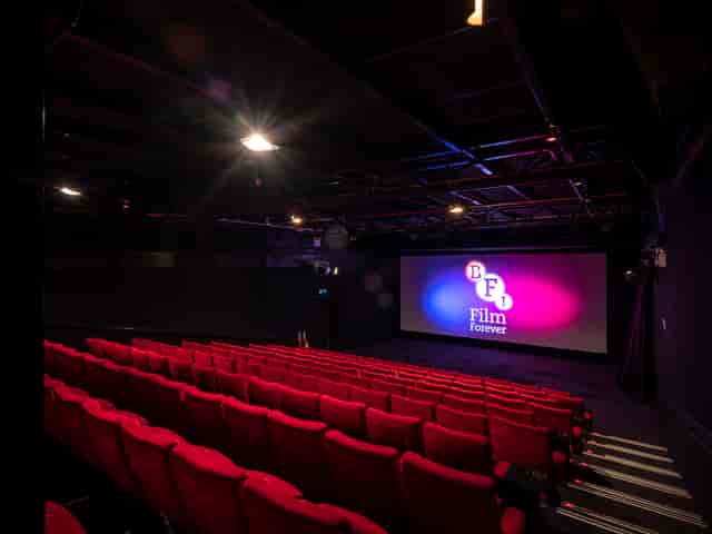 Modern cinema at BFI Southbank with vibrant red seating for film screenings.