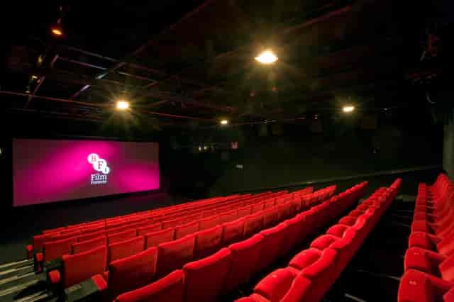Modern screening room at BFI Southbank with plush red seating for film festivals.