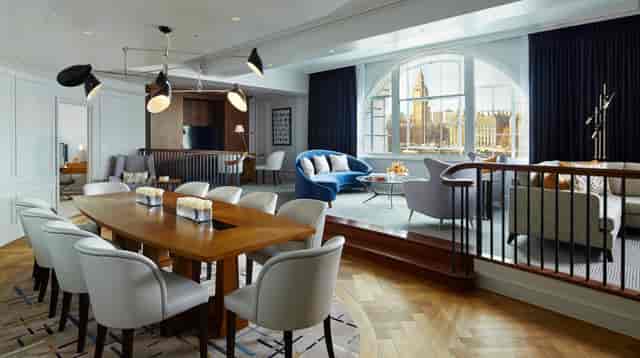 Westminster Suite at London Marriott: modern meeting space with large wooden table, ideal for events.
