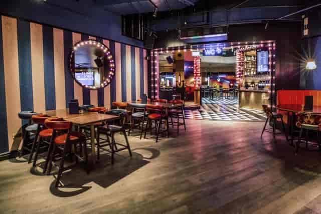 Vibrant event space at Puttshack Bank with modern decor for networking and gatherings.
