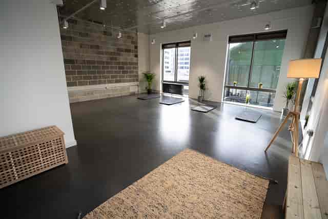 Modern event space with natural light, perfect for workshops and wellness retreats.