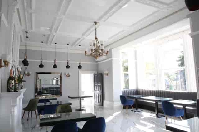 Hilltop Lounge at Ponsbourne Park Hotel, elegant event space with chandelier, corporate gatherings.