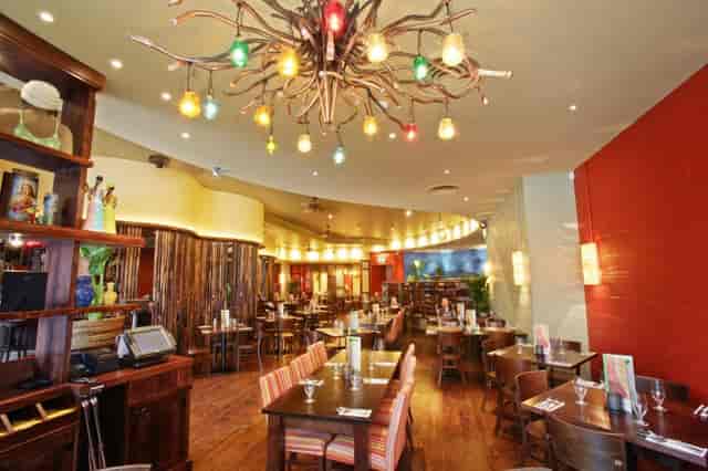 Vibrant Las Iguanas Leeds venue with unique chandelier for events and celebrations.