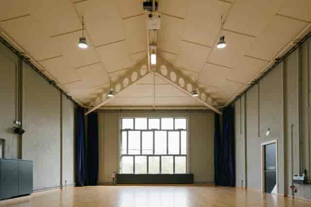 Spacious, well-lit event space with high ceilings at Contact Theatre for meetings and workshops.