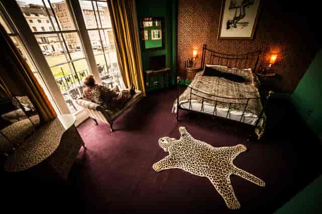 "Eclectic hotel room at Hotel Pelirocco, perfect for intimate gatherings and creative events."