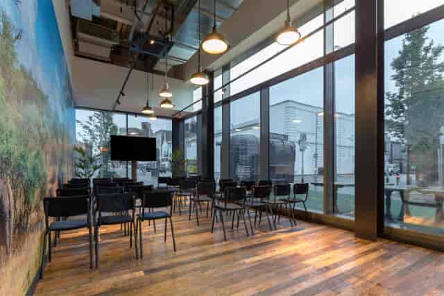 Modern meeting room with large windows for corporate events and workshops at The Light Cinema.