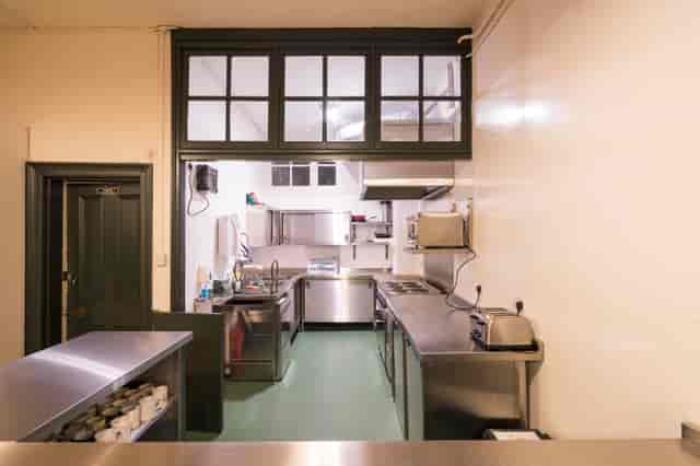 Commercial kitchen in Unity Islington, stainless steel surfaces for catering events.