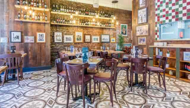 Charming Bella Italia venue with warm wood accents for intimate gatherings and corporate events.
