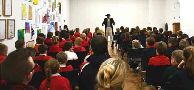 Lecture Theatre in Glynn Vivian Art Gallery with engaging speaker for children's events.