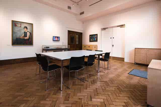 Garden Room at Glynn Vivian Art Gallery: minimalist meeting space with wooden flooring.