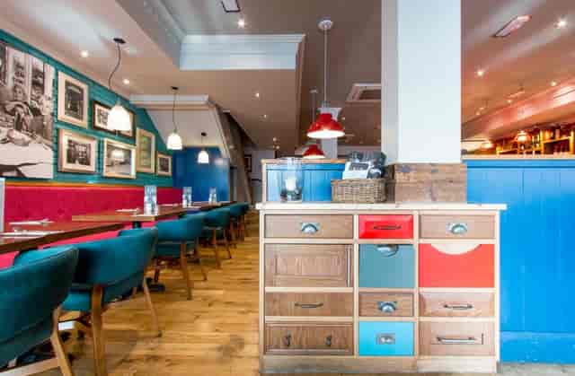 Vibrant Bella Italia Leeds venue with colorful decor for casual meetings and events.