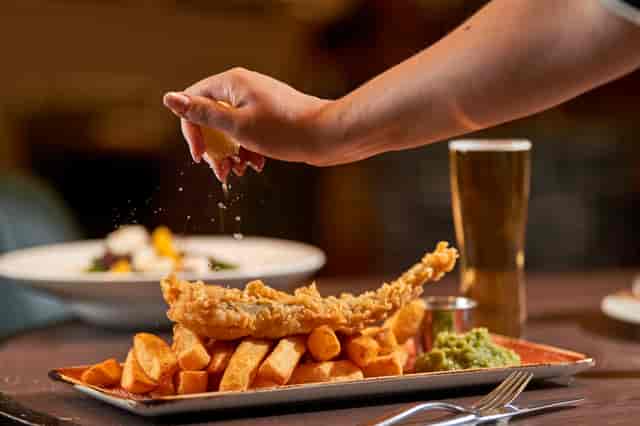 Crispy fish and chips at SOUND Sports Bar, ideal for networking events and casual dining.