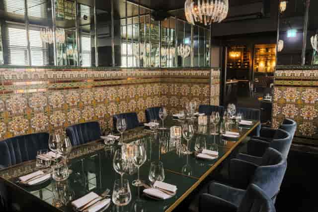 Elegant dining setup in Spanish Room, perfect for corporate meetings and exclusive events.