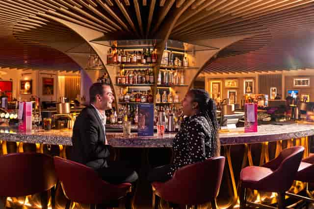 Stylish bar at Cafe Exclusive, ideal for networking events and informal meetings.