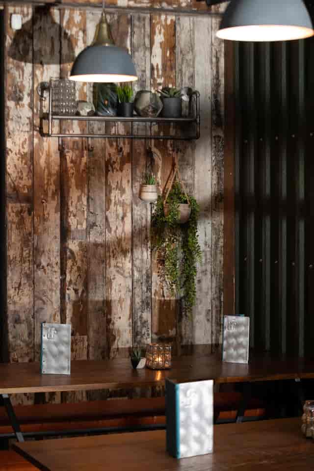 Rustic restaurant venue with weathered wood, ideal for events and gatherings.