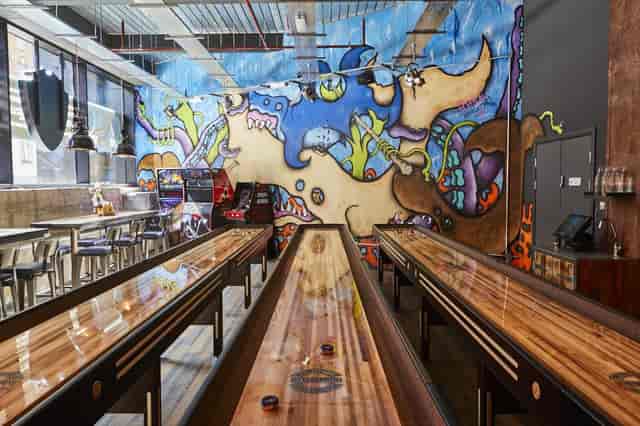 Games Room at BrewDog Tower Hill with shuffleboard, ideal for casual gatherings and team-building.