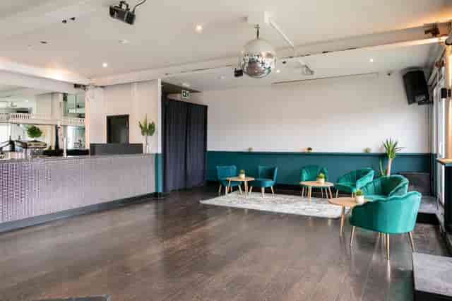Contemporary venue with bar and lounge seating for cocktail receptions and networking events.