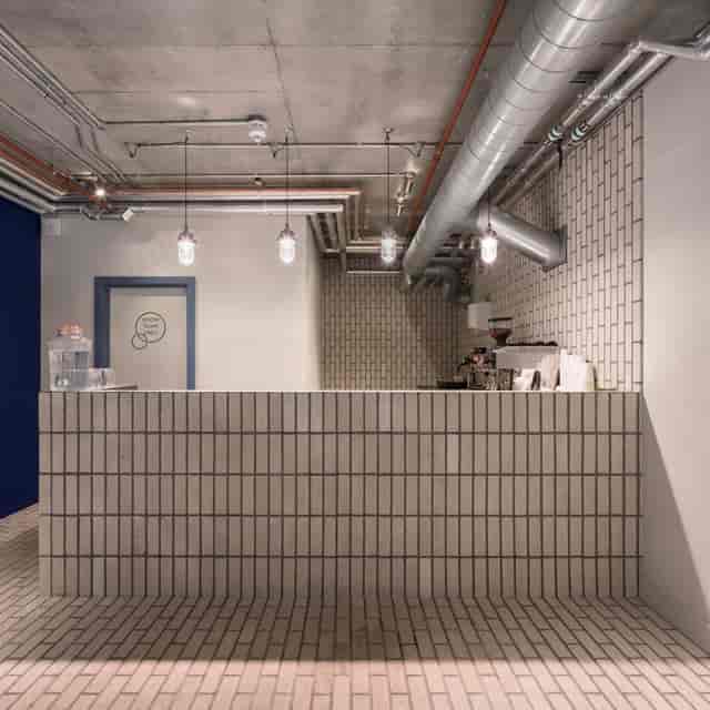 Modern reception area with coffee station for events and networking at Boom Cycle Battersea.