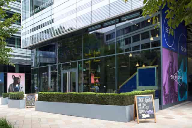 Modern reception area with large windows, ideal for networking events and gatherings.