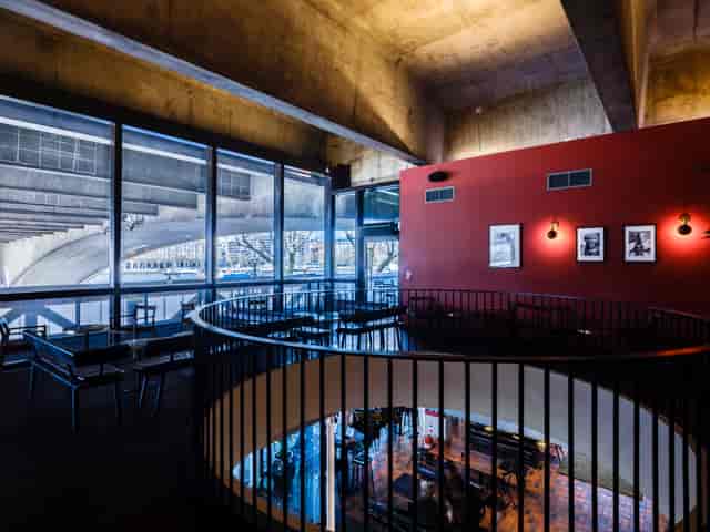 Riverfront and Balcony Bar, modern venue with large windows for networking events.